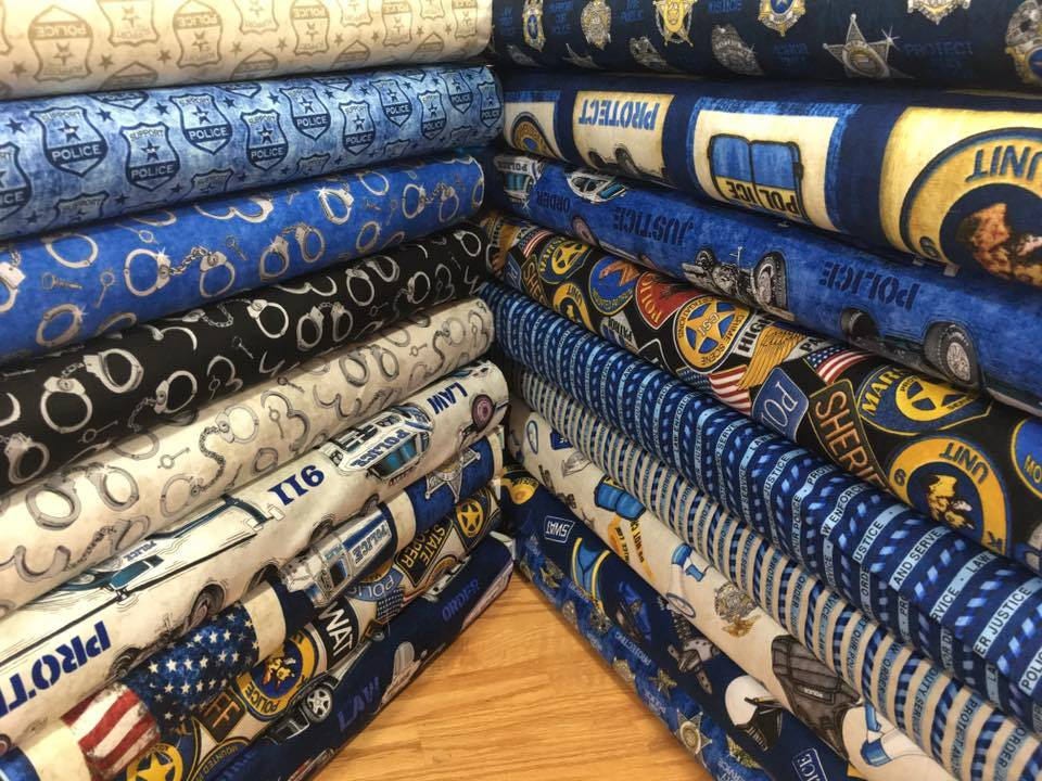 Protect and Serve Tonal Shields Ecru 26132E Cotton Woven Fabric