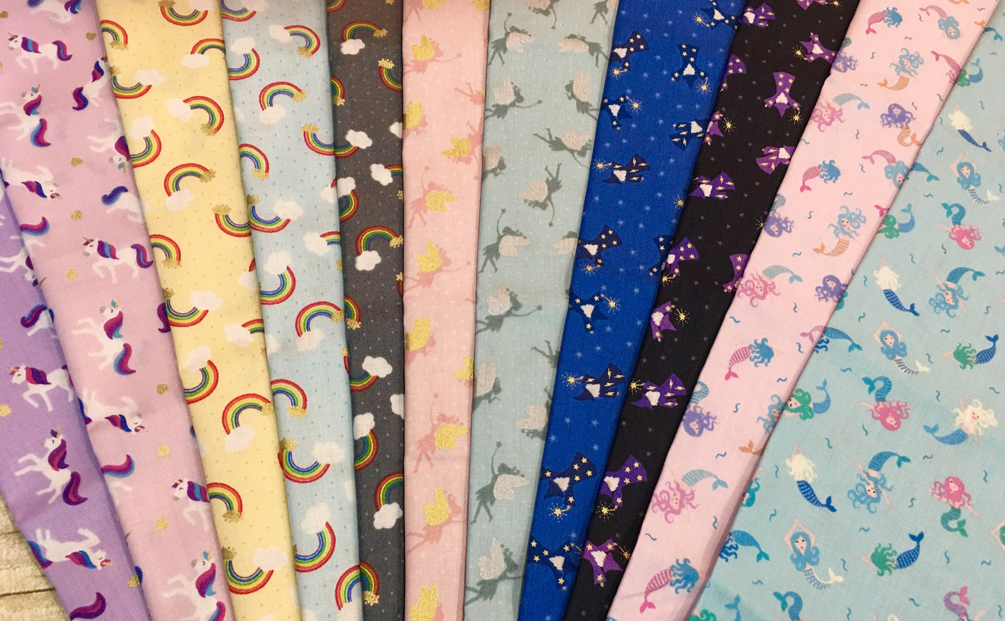 Small Things Tossed Rainbows on Pale Blue with Gold Metallic SM8.1 Cotton Woven Fabric