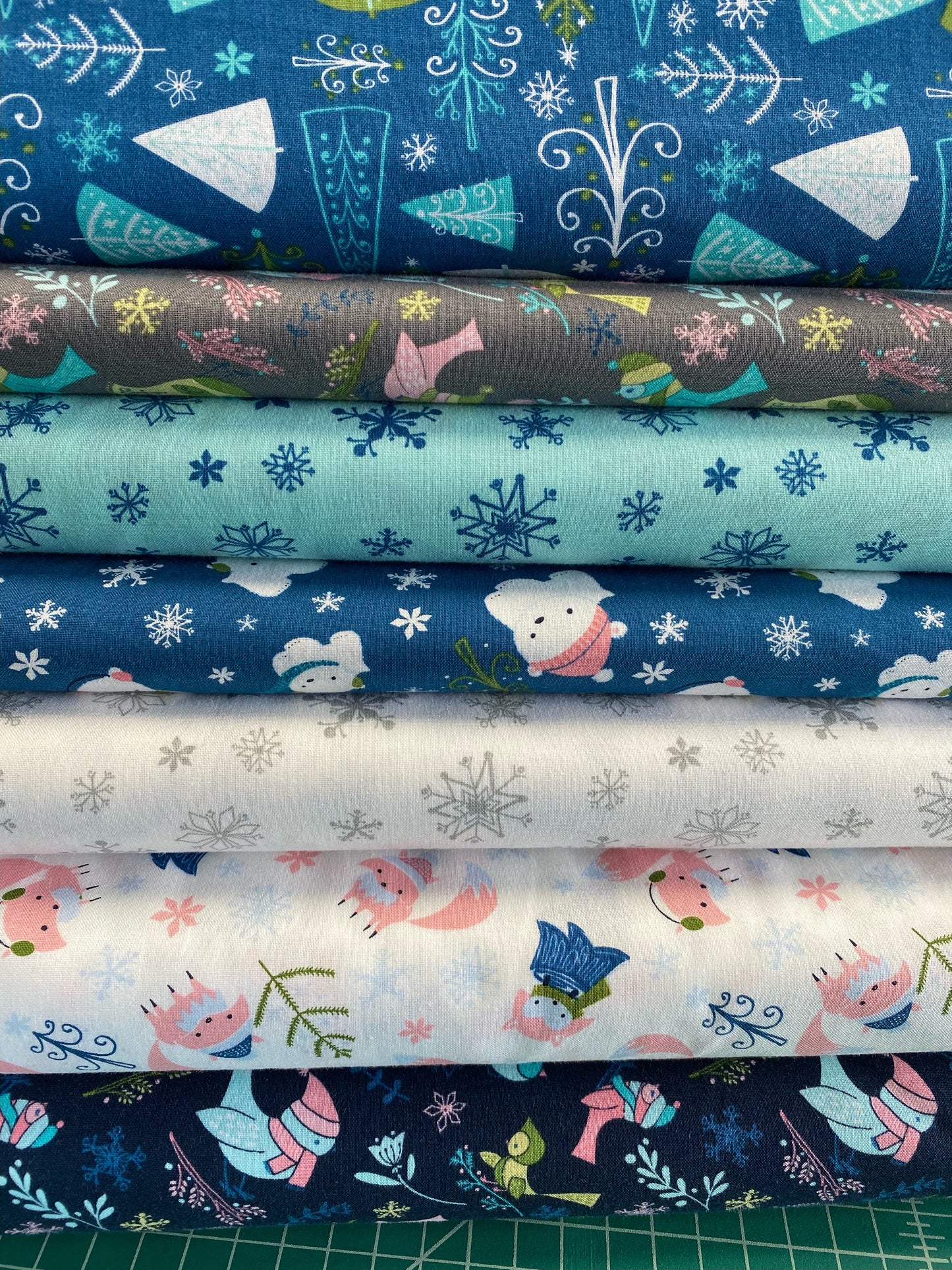 Winter Wonderland by Heather Rosas Trees on Blue Cotton Woven Fabric