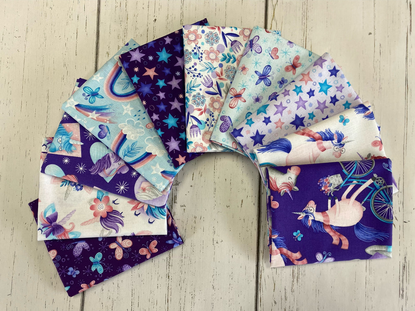 Sparkle Like a Unicorn by Danielle Hartgers Unicorn Faces Med. Purple    1859-52 Cotton Woven Fabric