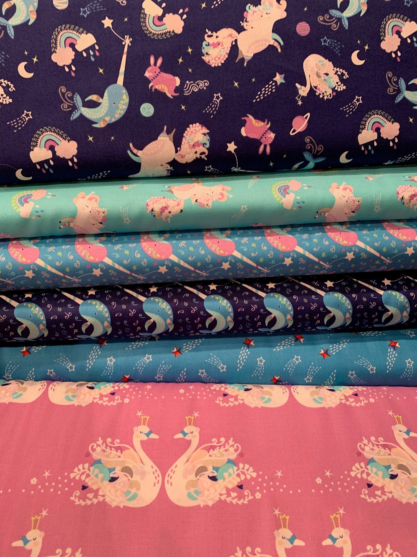 Out of This World Glow Dancing Unicorns in Blue Glow in the Dark Cotton Woven Fabric